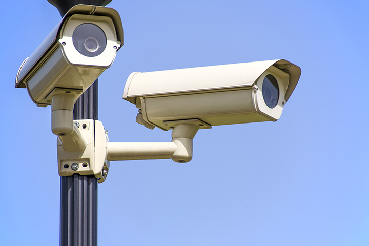 two video cameras mounted to a pole